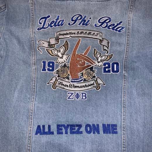 Custom Greek-life embroidery on a denim jacket