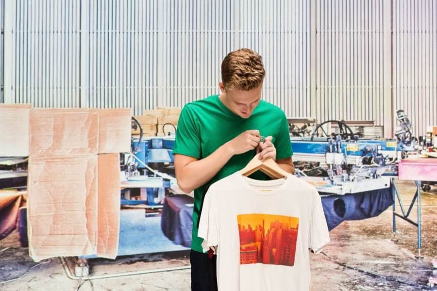 Custom printed T-shirt held inside Assured Print's Lanham, Maryland shop